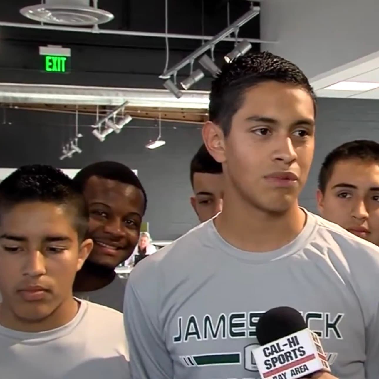 James Lick High School soccer players gathered near a Cal-Hi Sports TV microphone during a media day interview.